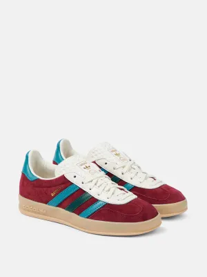 Burgundy suede trainers with blue stripes