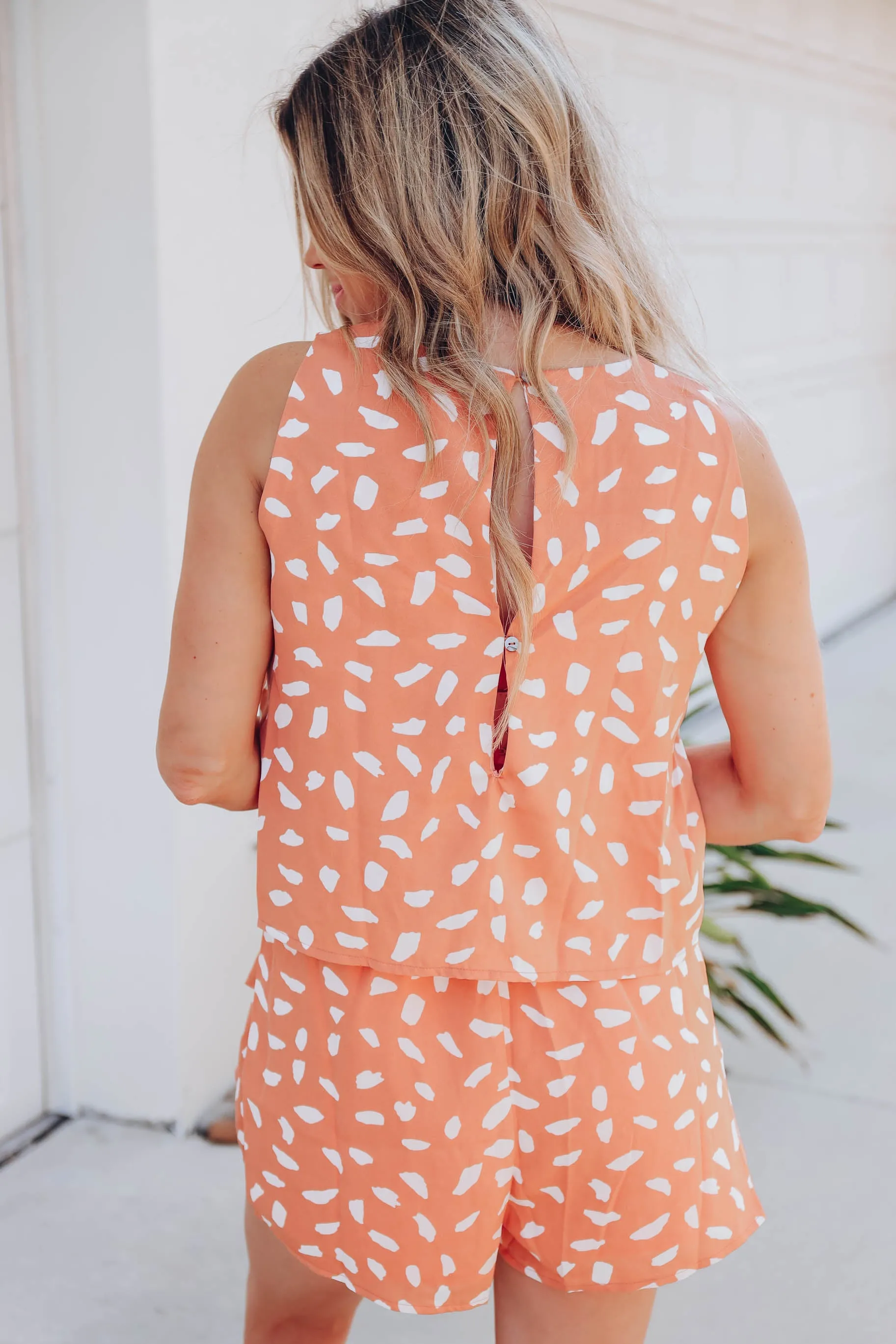 Peach Flounce Dalmatian Dot Romper