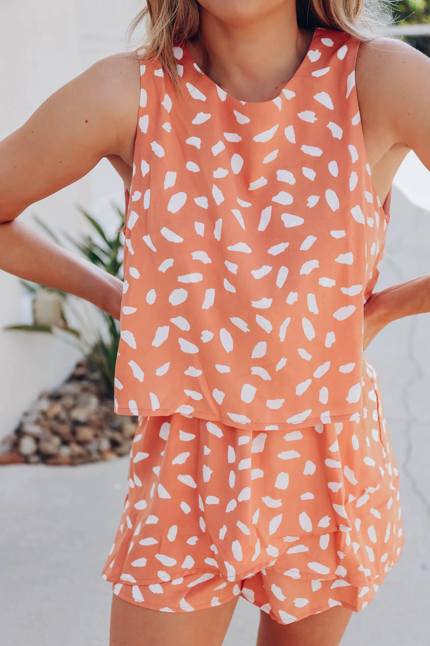 Peach Flounce Dalmatian Dot Romper